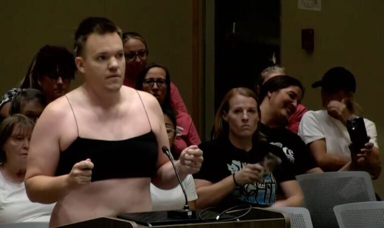 Dad strips down to crop top and Daisy Dukes in protest at school’s dress code meeting